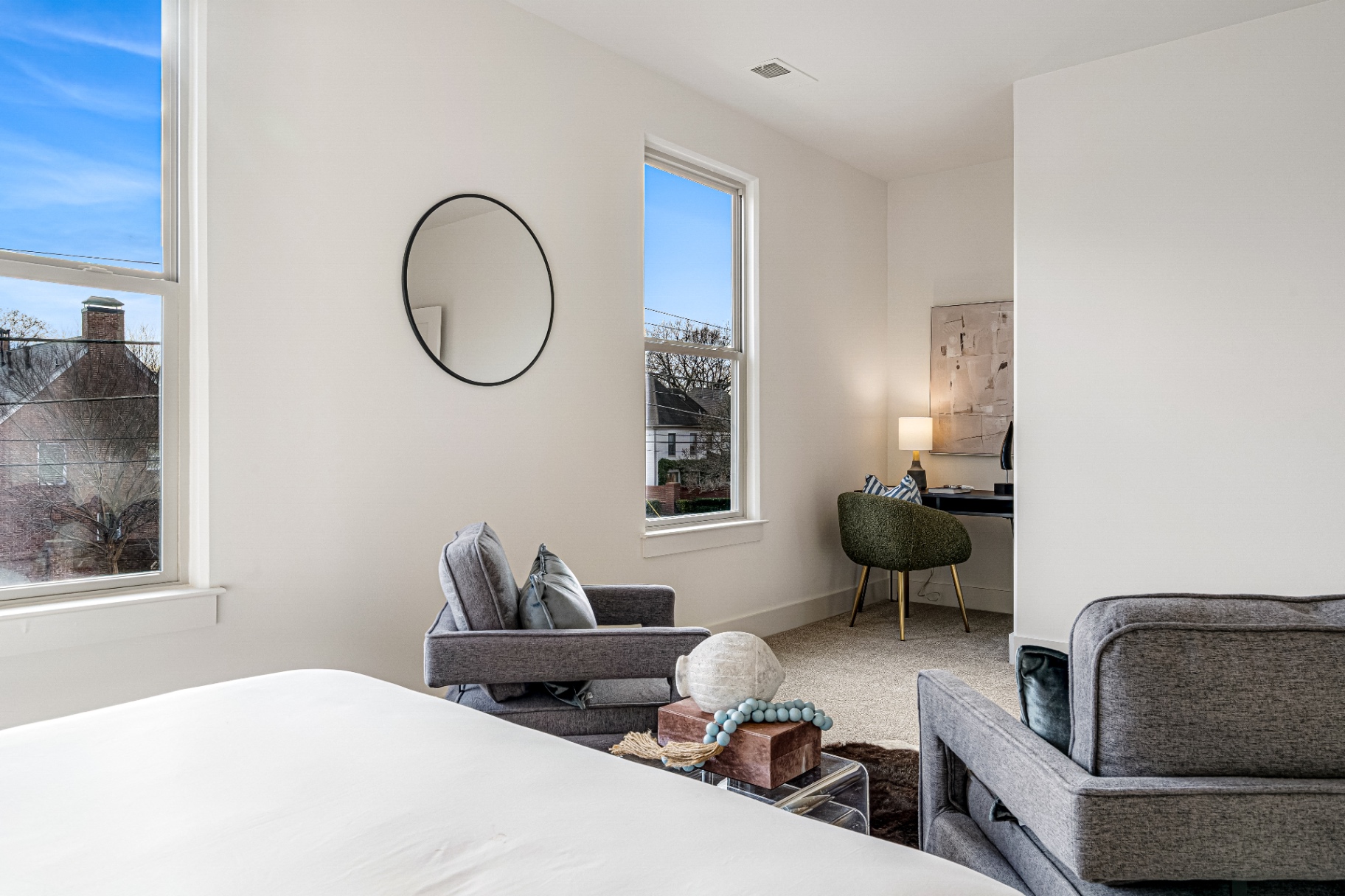 Bedroom corner with study desk and twin windows